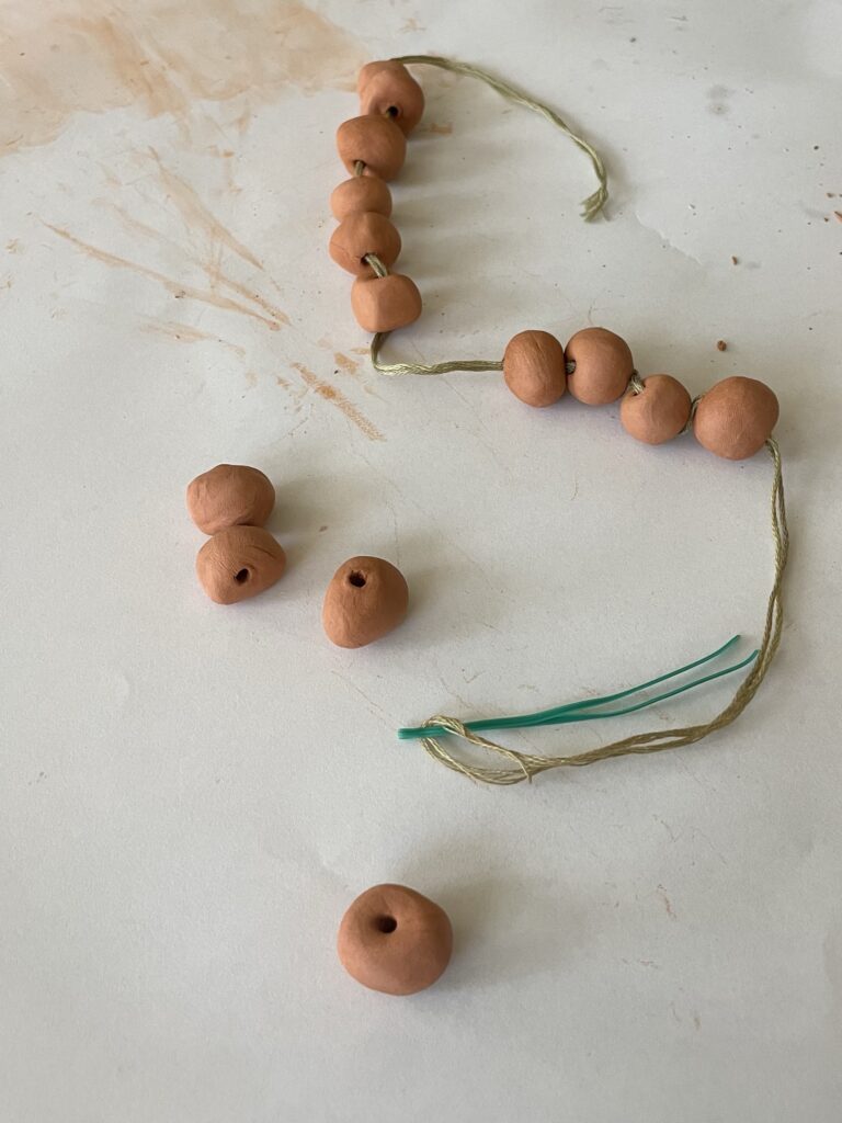 Make a DIY Terracotta Bead Garland with Air Dry Clay - Perfecting Places